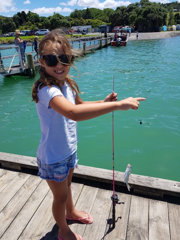 Girl fishing at Parua Bay